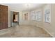 Bright breakfast area with tiled floors, brick accent wall, and a chandelier at 133 Persimmon Creek Rd # 81, Kings Mountain, NC 28086