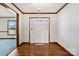 Bright foyer featuring a white front door with sidelights, hardwood flooring, and beautiful trim work throughout at 133 Persimmon Creek Rd # 81, Kings Mountain, NC 28086