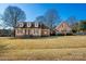 Charming exterior view of a well-maintained home with brick and siding, dormer windows and a spacious front yard at 133 Persimmon Creek Rd # 81, Kings Mountain, NC 28086