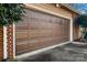 Brown garage door with a brick surround and an automatic opener at 133 Persimmon Creek Rd # 81, Kings Mountain, NC 28086