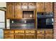 Close up on the wooden cabinets and built-in oven in this kitchen at 133 Persimmon Creek Rd # 81, Kings Mountain, NC 28086
