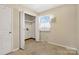 Laundry room with open closet and window that brings in natural light at 133 Persimmon Creek Rd # 81, Kings Mountain, NC 28086