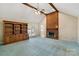 Spacious living room with vaulted ceilings, a brick fireplace, and a ceiling fan to create a cozy atmosphere at 133 Persimmon Creek Rd # 81, Kings Mountain, NC 28086