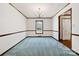 Living room with a charming chandelier and window adding natural light at 133 Persimmon Creek Rd # 81, Kings Mountain, NC 28086