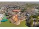 Stunning aerial view of lakefront property featuring lush greenery and serene water views at 13701 Petworth Ct, Charlotte, NC 28278