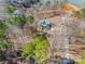 Aerial view of a charming home nestled in a lush, wooded area, offering privacy and scenic beauty at 13701 Petworth Ct, Charlotte, NC 28278