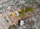 Aerial view of property with surrounding trees, showcasing the home's serene and private setting at 13701 Petworth Ct, Charlotte, NC 28278
