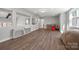 Finished basement space with wood-look floors provides ample room for recreation at 13701 Petworth Ct, Charlotte, NC 28278