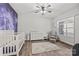 Bedroom with natural light, wood floors, and a galaxy wall design at 13701 Petworth Ct, Charlotte, NC 28278