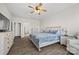 Bright bedroom featuring wood floors, night stands, and a TV at 13701 Petworth Ct, Charlotte, NC 28278