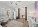 Bedroom with wood floors, natural light, and barn doors at 13701 Petworth Ct, Charlotte, NC 28278