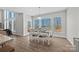 Dining area with large windows and a view of the lake at 13701 Petworth Ct, Charlotte, NC 28278
