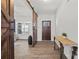 Welcoming entryway with wood floors, a sliding barn door, and ample natural light at 13701 Petworth Ct, Charlotte, NC 28278