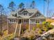 Charming home featuring stone accents, a welcoming front porch, and well-maintained landscaping at 13701 Petworth Ct, Charlotte, NC 28278