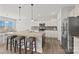 Bright kitchen features stainless steel appliances, granite countertops, kitchen island, and bar stool seating at 13701 Petworth Ct, Charlotte, NC 28278