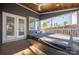 Relaxing covered back porch with a hot tub, wooden ceiling, and string lights at 13725 Mallory Baches Ln, Huntersville, NC 28078