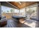 Relaxing covered back porch with a hot tub, wooden ceiling, and string lights at 13725 Mallory Baches Ln, Huntersville, NC 28078