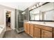 Modern bathroom with double vanity, frameless glass shower, and separate soaking tub at 13725 Mallory Baches Ln, Huntersville, NC 28078