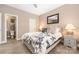Cozy bedroom with a plush bed, decorative pillows, and access to an ensuite bathroom at 13725 Mallory Baches Ln, Huntersville, NC 28078