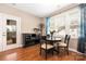 Cozy dining area with hardwood floors, lots of windows and black accent furniture at 13725 Mallory Baches Ln, Huntersville, NC 28078