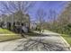 Charming two-story home with a inviting front porch and manicured lawn on a tree lined street at 13725 Mallory Baches Ln, Huntersville, NC 28078