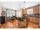 Eat-in kitchen with hardwood floors, granite countertops, stainless steel appliances and an eat in kitchen at 13725 Mallory Baches Ln, Huntersville, NC 28078
