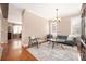 Stylish living room with hardwood floors and a comfortable blue couch at 13725 Mallory Baches Ln, Huntersville, NC 28078