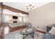 Cozy living space with a fireplace, hardwood floors, and plush sofas at 13725 Mallory Baches Ln, Huntersville, NC 28078