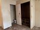 Small adjacent bathroom with stained walls and damage at 1406 Ratchford Dr, Dallas, NC 28034