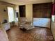 Bedroom with damaged hardwood floors at 1406 Ratchford Dr, Dallas, NC 28034