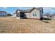 Backyard view of home with screened-in porch and spacious yard at 1529 Alex Dr, Shelby, NC 28152