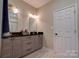 Bathroom features double sinks, granite counters, wood cabinets, and tile floors at 1529 Alex Dr, Shelby, NC 28152