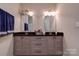 Bathroom features double sinks, granite counters, wood cabinets, and tile floors at 1529 Alex Dr, Shelby, NC 28152