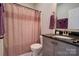 Bathroom features a granite countertop, vanity, shower with curtain, and modern fixtures at 1529 Alex Dr, Shelby, NC 28152