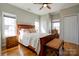 Bright bedroom with hardwood floors, bench seating, and ample natural light from multiple windows at 1529 Alex Dr, Shelby, NC 28152