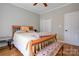 Bedroom with hardwood floors, ceiling fan, bench seating, and double door closet at 1529 Alex Dr, Shelby, NC 28152