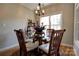 Cozy dining area with a glass-top table, stylish chandelier, and a sunlit window at 1529 Alex Dr, Shelby, NC 28152