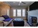 Bright living room with hardwood floors, large windows, fireplace, and modern decor at 1529 Alex Dr, Shelby, NC 28152