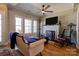 Cozy living room featuring hardwood floors, a fireplace, natural light, and stylish furniture at 1529 Alex Dr, Shelby, NC 28152