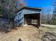 This is a barn with two levels and a metal roof in a rural area at 17118 Frog Pond Rd, Oakboro, NC 28129