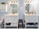 Bathroom featuring dual sinks, great natural light, modern vanities, and updated tile flooring at 17118 Frog Pond Rd, Oakboro, NC 28129
