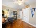 This bedroom is decorated in a baseball theme, with a desk and hardwood floors at 17118 Frog Pond Rd, Oakboro, NC 28129