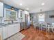Bright kitchen features granite countertops, stainless steel appliances, and a dining area at 17118 Frog Pond Rd, Oakboro, NC 28129
