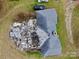 Aerial view of a house showing roof damage and debris in the back yard at 2126 W C St, Kannapolis, NC 28081
