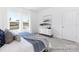 Comfortable bedroom featuring a large window, dresser and stylish decor at 219 Tillery Ln # 754P, Mount Gilead, NC 27306