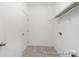 Practical laundry room area with wire shelving at 219 Tillery Ln # 754P, Mount Gilead, NC 27306