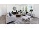 Bright living room featuring modern furnishings, neutral decor, and natural light at 219 Tillery Ln # 754P, Mount Gilead, NC 27306