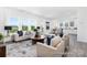 Inviting living room with modern furnishings, bright windows and neutral decor at 219 Tillery Ln # 754P, Mount Gilead, NC 27306