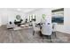 Bright, airy living space featuring wood-look floors, a comfortable sofa and large windows at 219 Tillery Ln # 754P, Mount Gilead, NC 27306