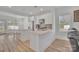 Bright kitchen with white cabinetry, stainless steel appliances, and an island with bar seating at 293 Blanche Cir, Rock Hill, SC 29730